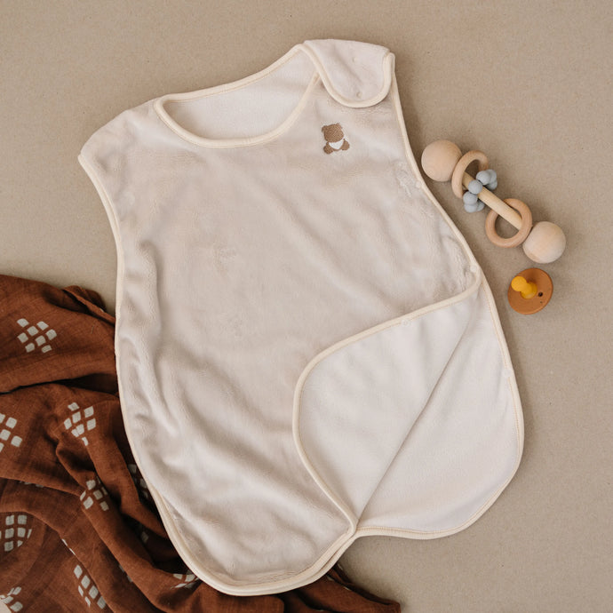 Top down view of the Zinoa Sleepsuit with toys.